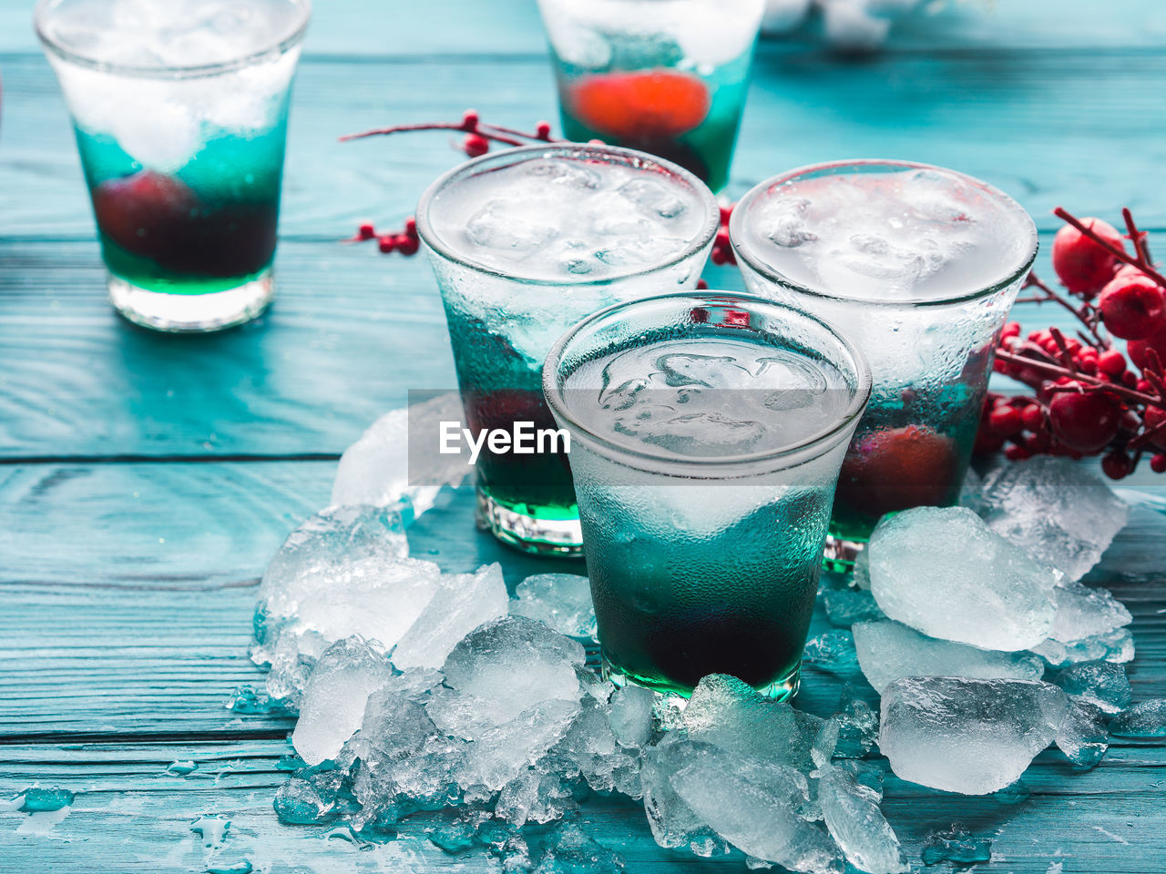 CLOSE-UP OF ICE TEA ON GLASS TABLE