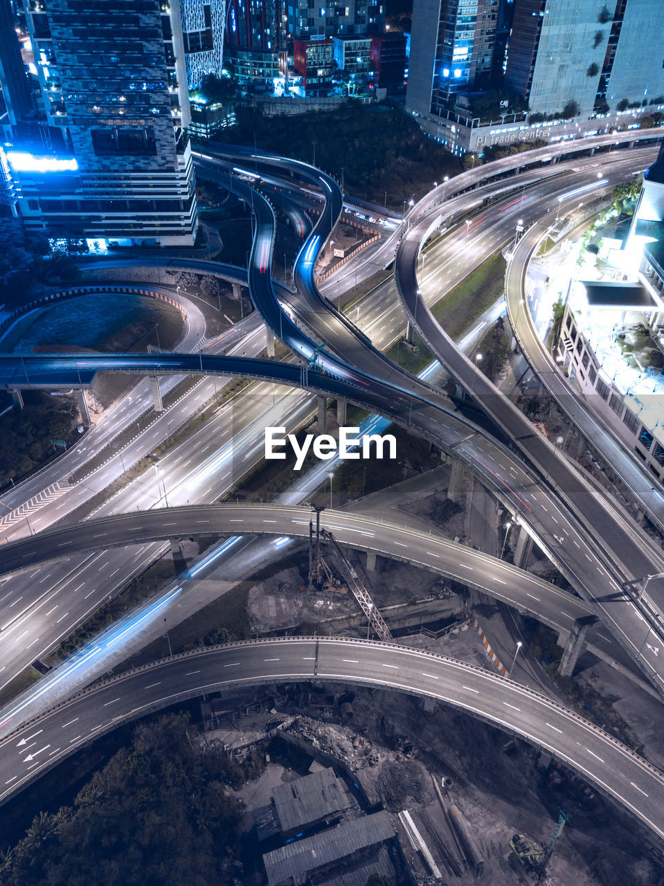 HIGH ANGLE VIEW OF LIGHT TRAILS ON ROAD