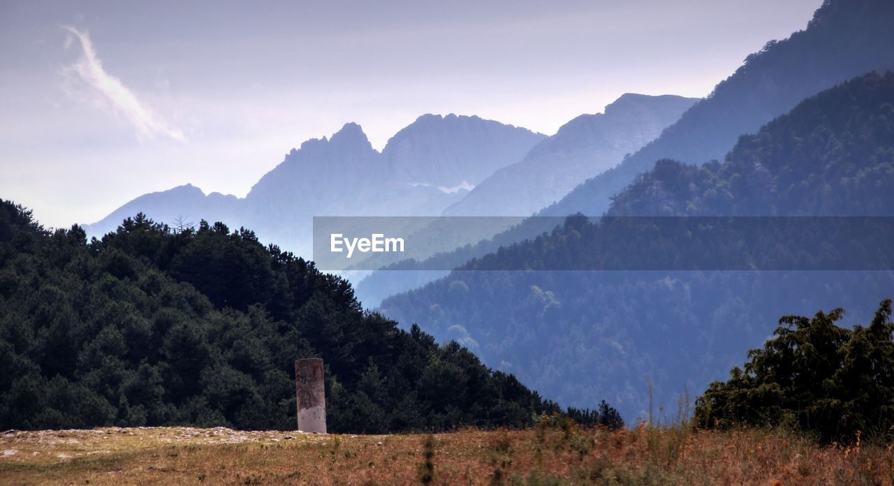 Scenic view of silhouette mountains against sky