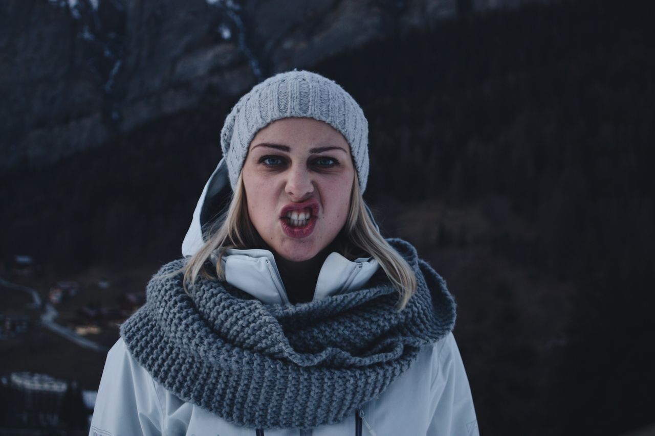 Portrait of young woman wearing warm clothing