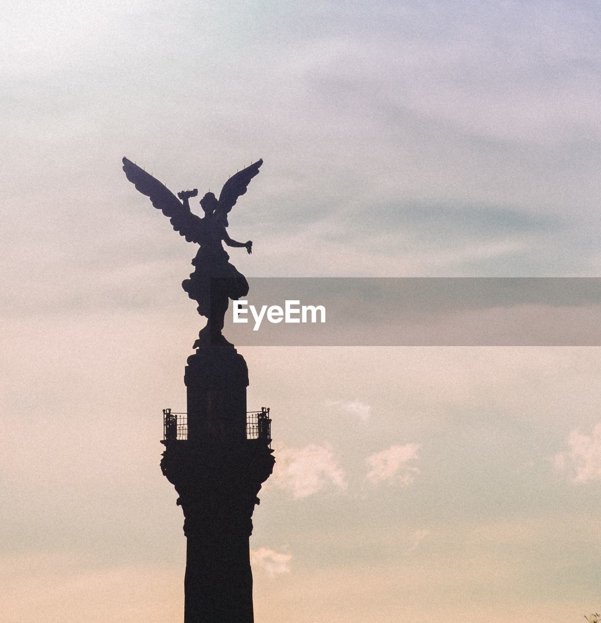 LOW ANGLE VIEW OF A STATUE OF A BIRD