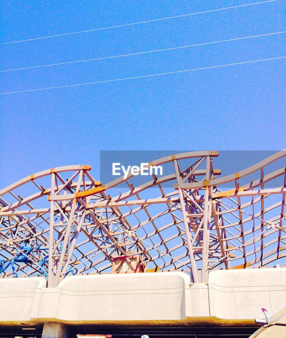 LOW ANGLE VIEW OF METAL STRUCTURE AGAINST CLEAR SKY