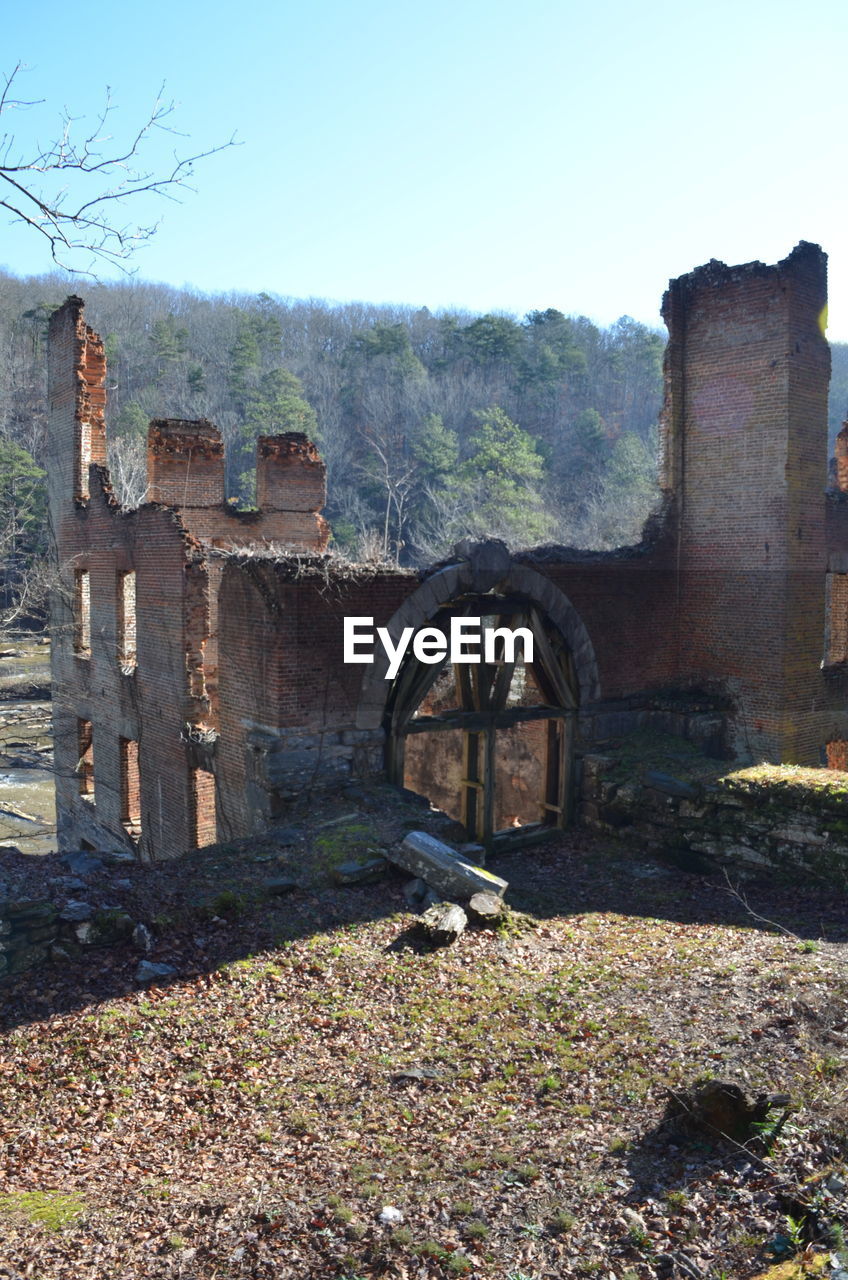 High angle view of weathered building against sky