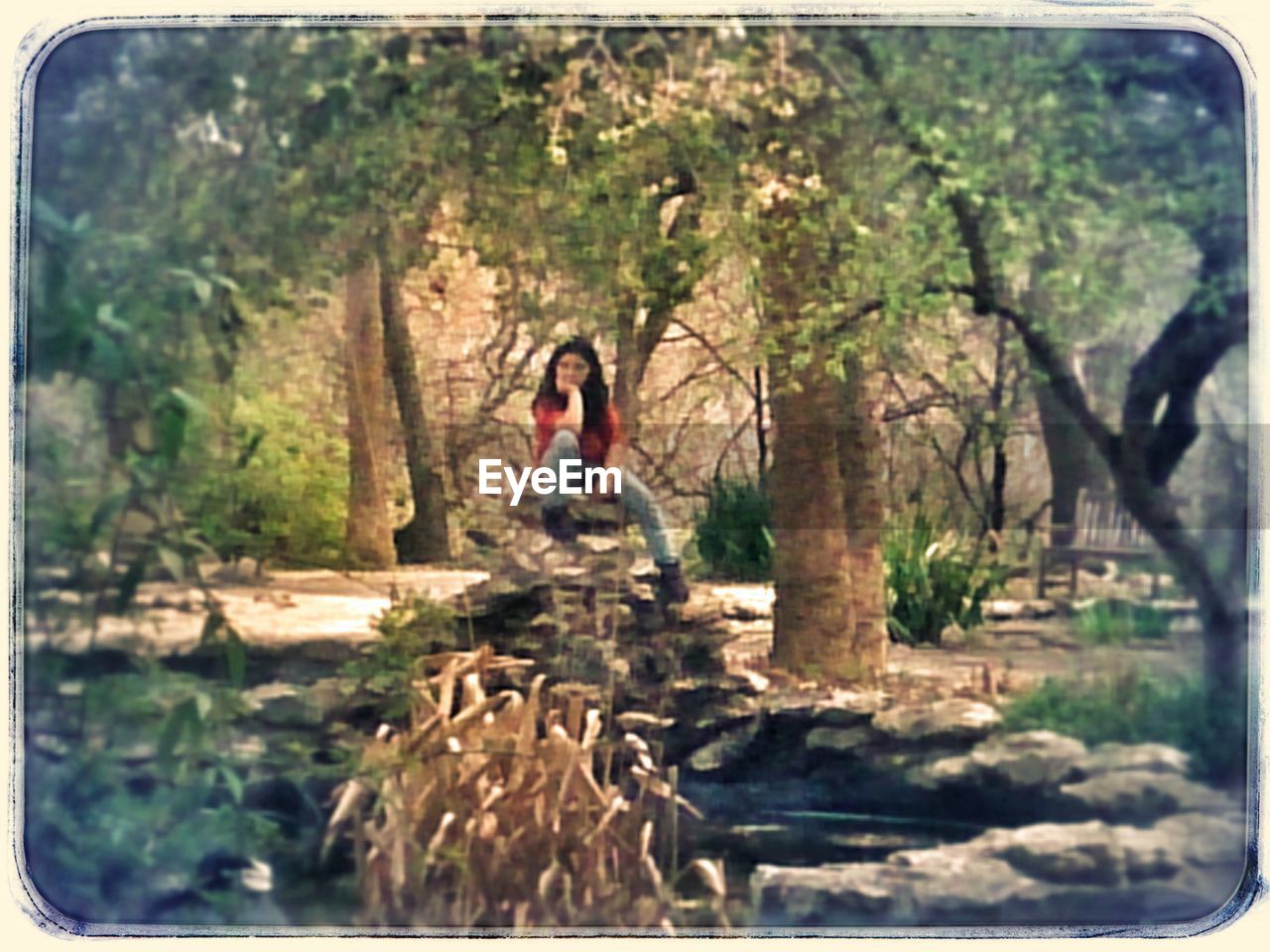 WOMAN STANDING IN FOREST