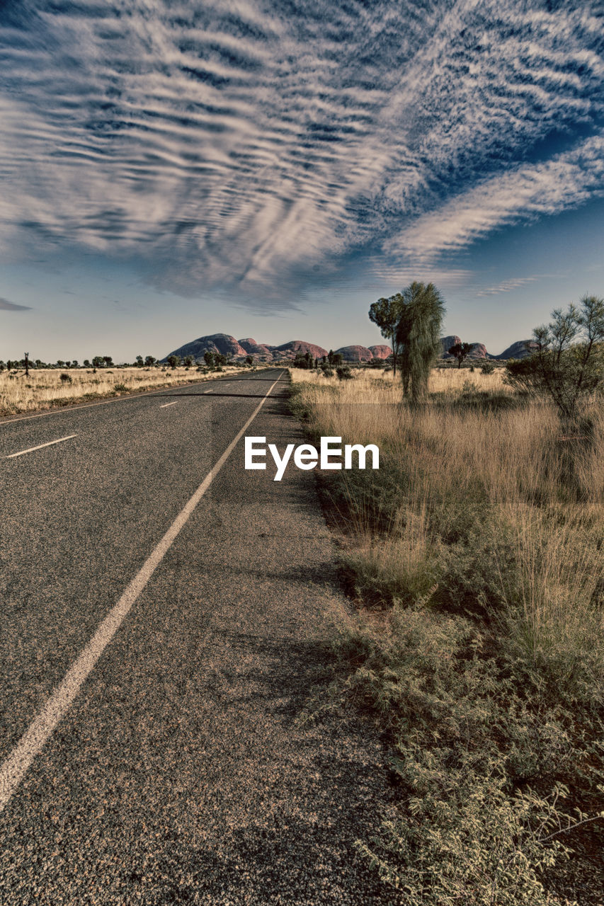 VIEW OF EMPTY ROAD ON FIELD