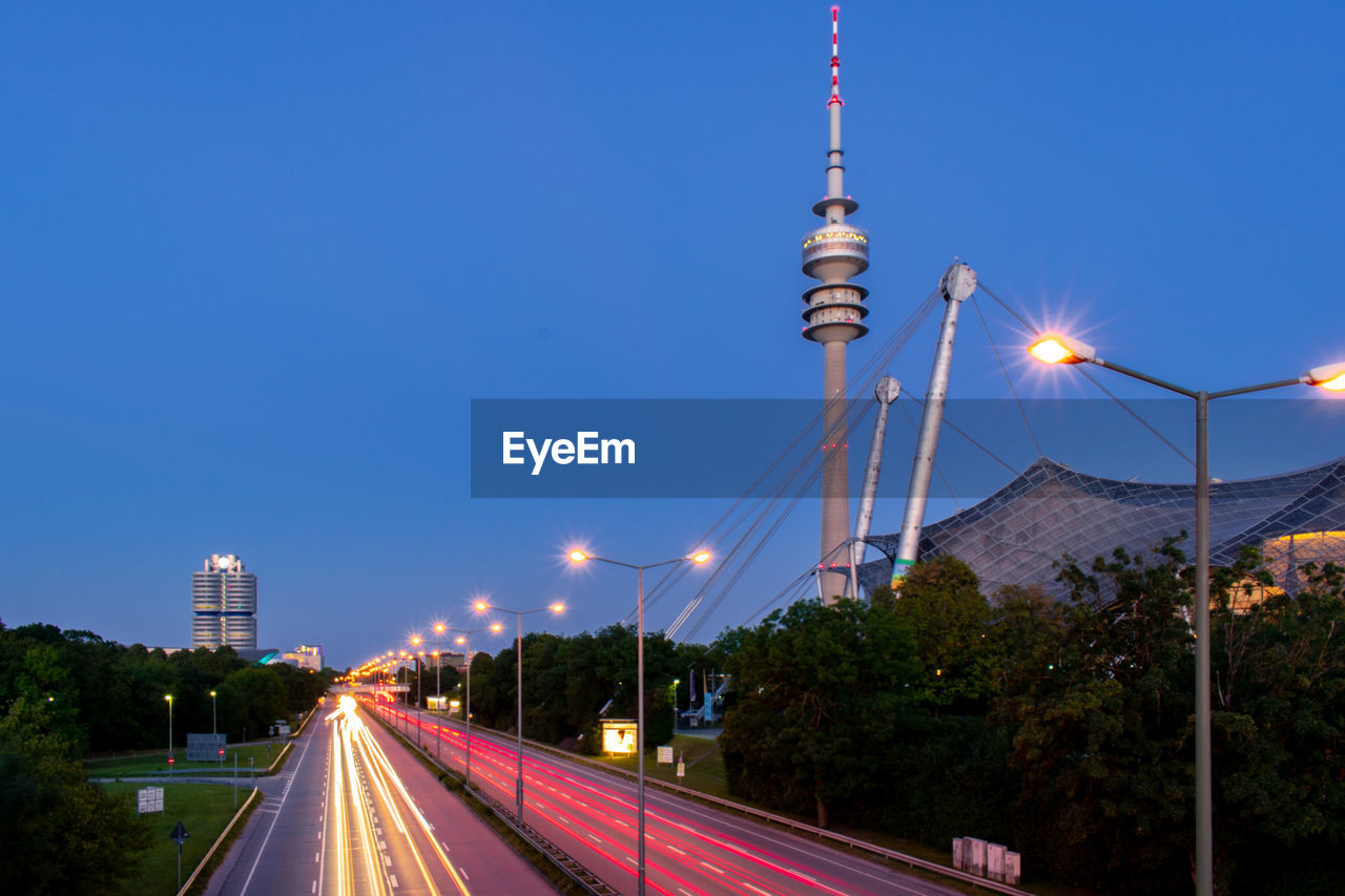 Light trail and buildings against sky in munich