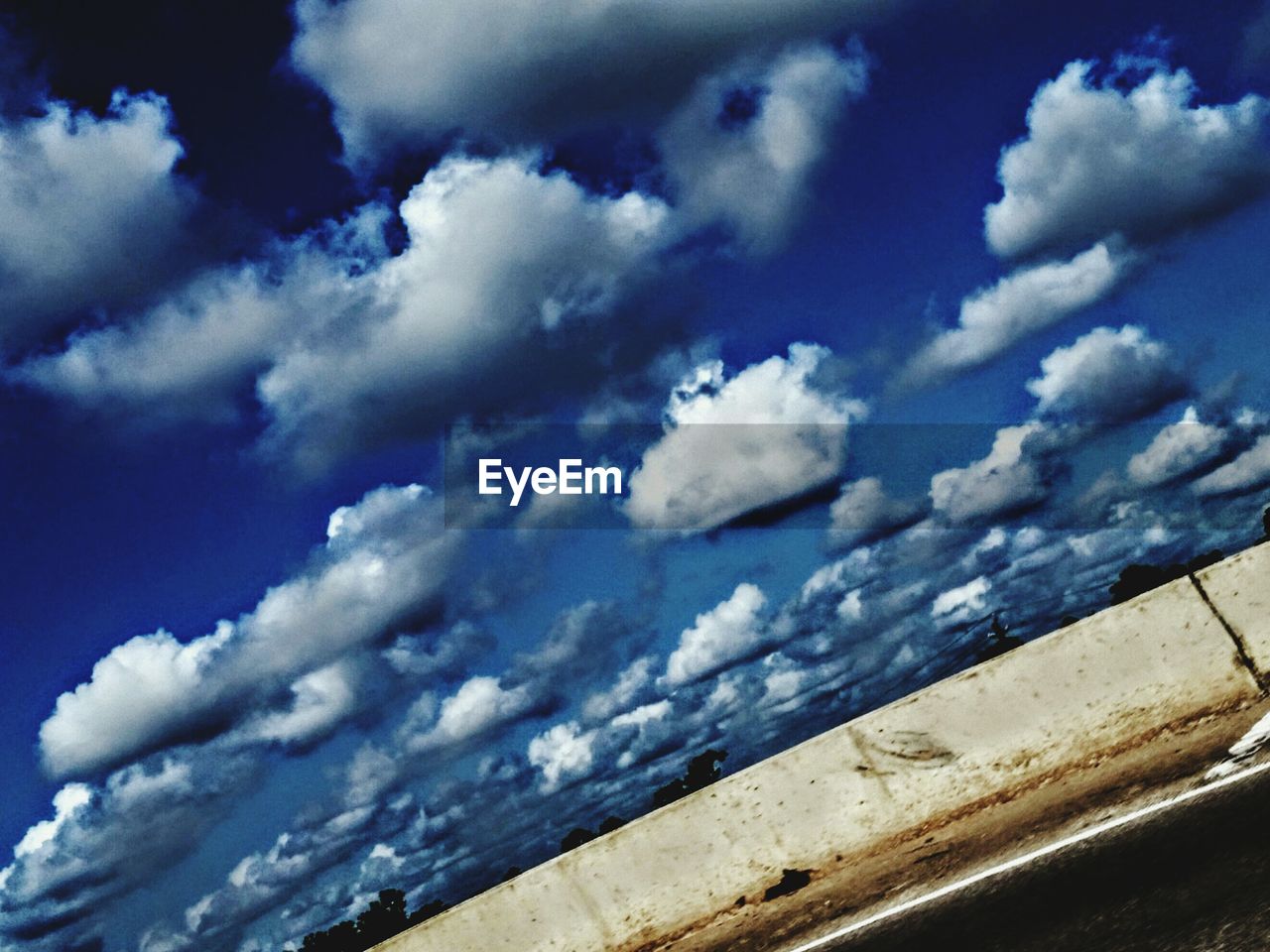 LOW ANGLE VIEW OF BLUE SKY AND CLOUDS