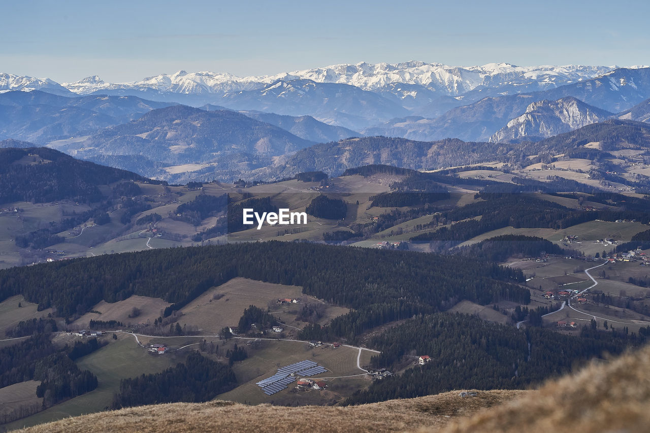 High angle view of snowcapped mountains against sky