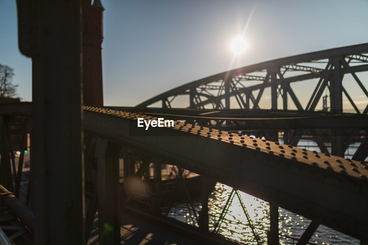 LOW ANGLE VIEW OF BRIDGE AGAINST SKY IN CITY