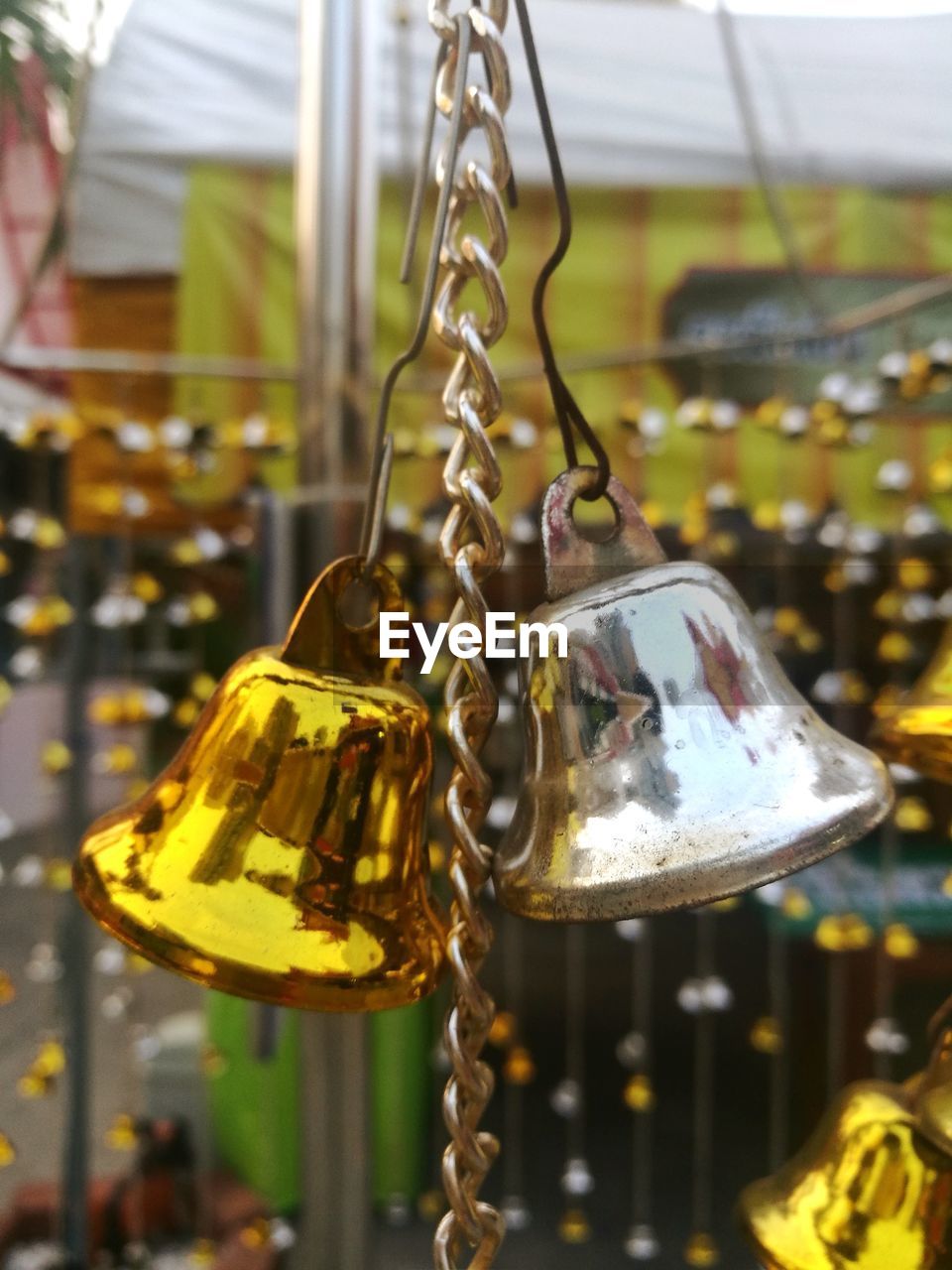 CLOSE-UP OF CHAIN SWING HANGING ON METAL