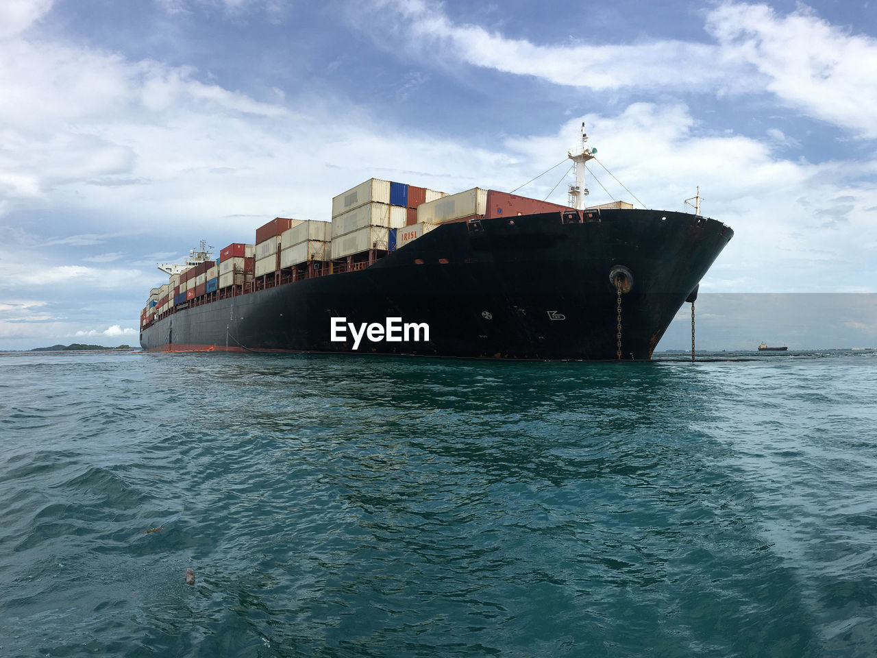 Ship sailing on sea against sky