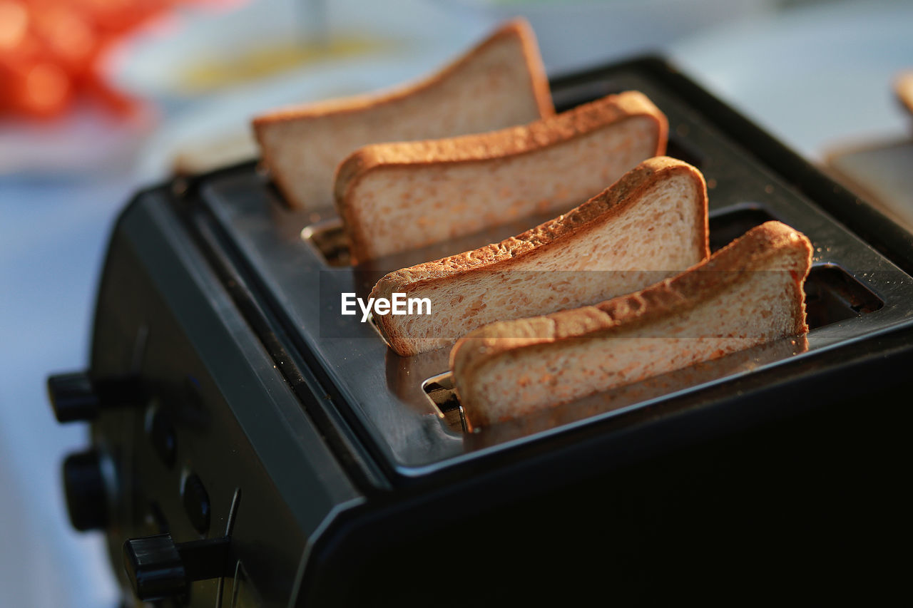 High angle close-up of bread in toaster