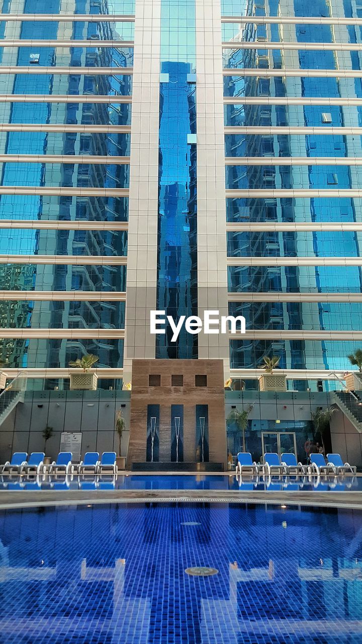 LOW ANGLE VIEW OF MODERN BUILDINGS AGAINST SKY