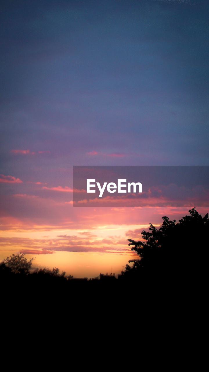 SCENIC VIEW OF SILHOUETTE LANDSCAPE AGAINST ORANGE SKY