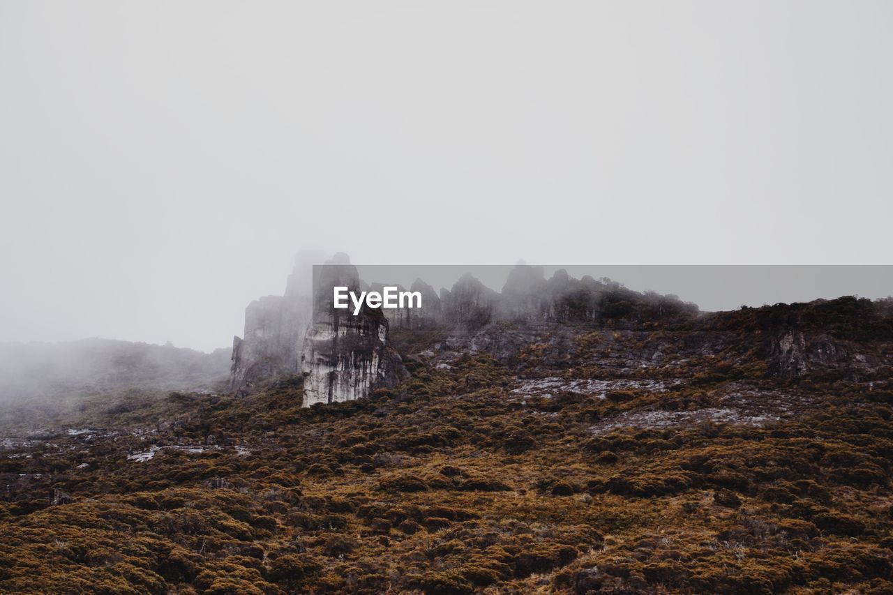 Scenic view of mountains during foggy weather