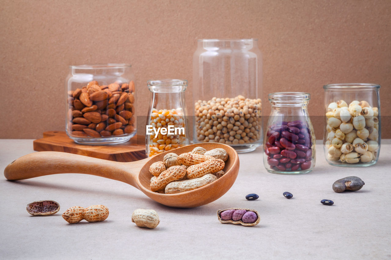 Variety of food in glass jars on table