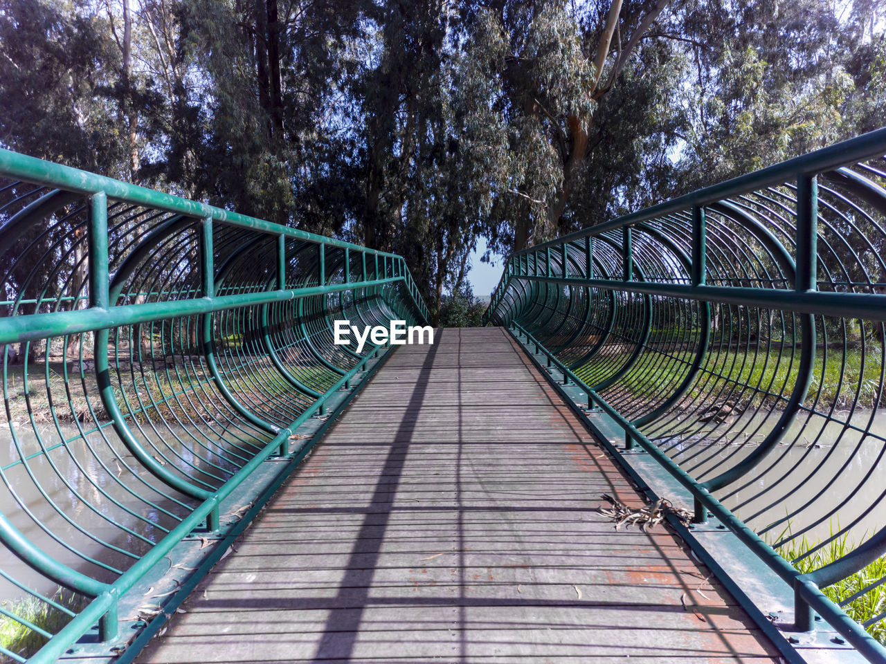 A photo of a wood and steel bridge across the naaman stream in northern israel