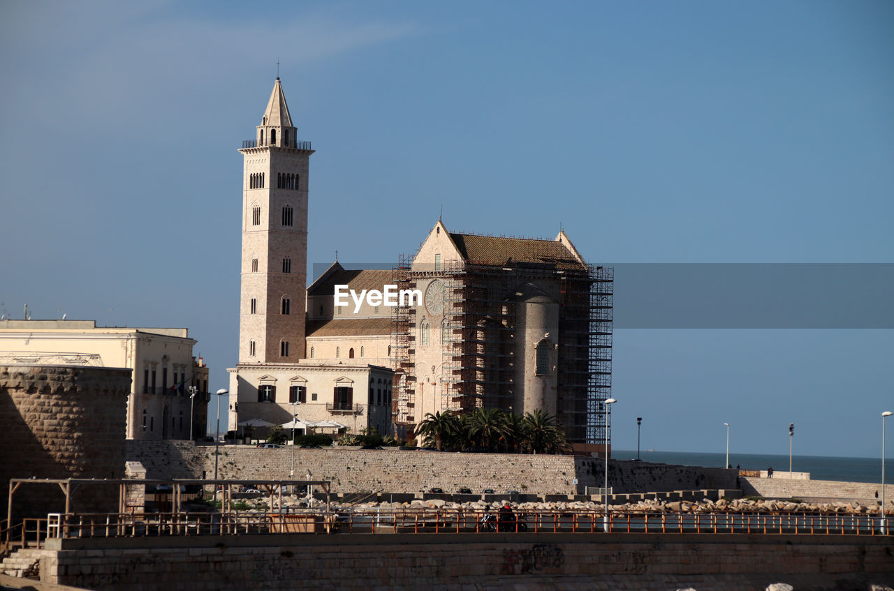 Trani, italy, 4 december 2022, the cathedral and the fort seen from the roof garden on the sea