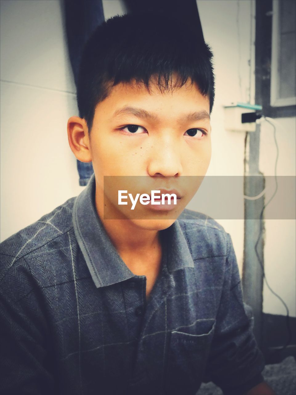 CLOSE-UP PORTRAIT OF BOY WEARING EYEGLASSES