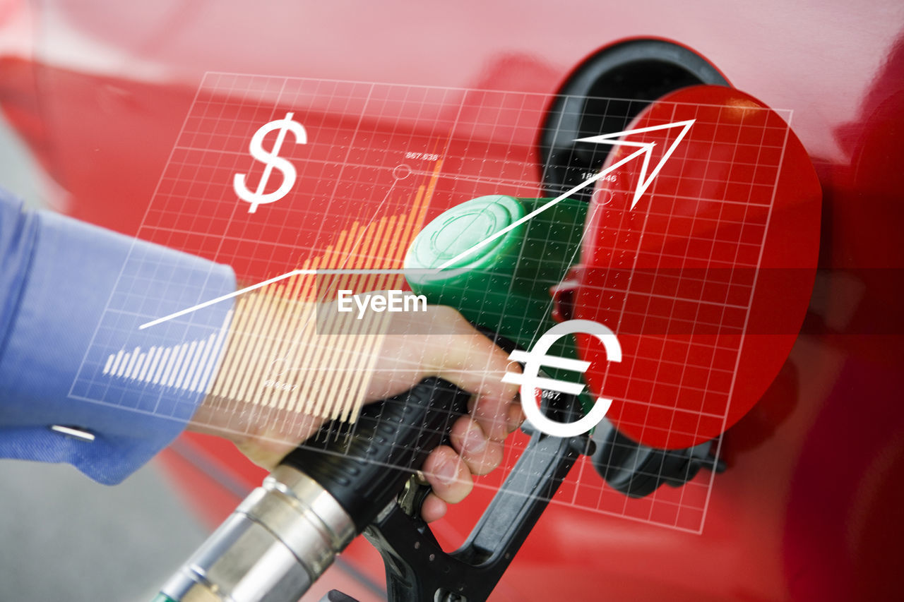 Financial chart and man holding fuel pump