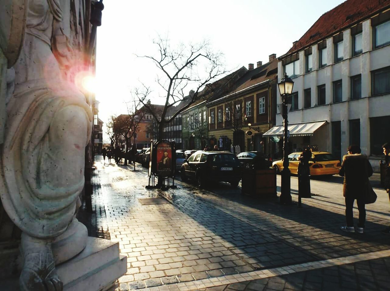 MAN WALKING IN CITY