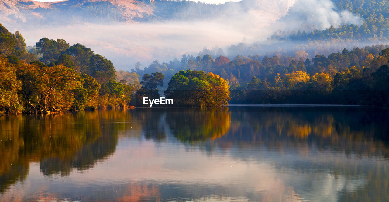 Scenic view of lake against sky during autumn