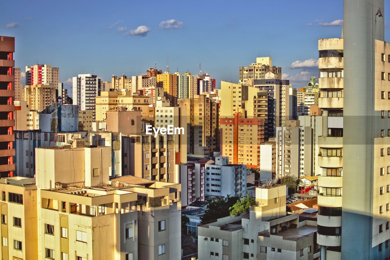 High angle view of buildings in city against sky