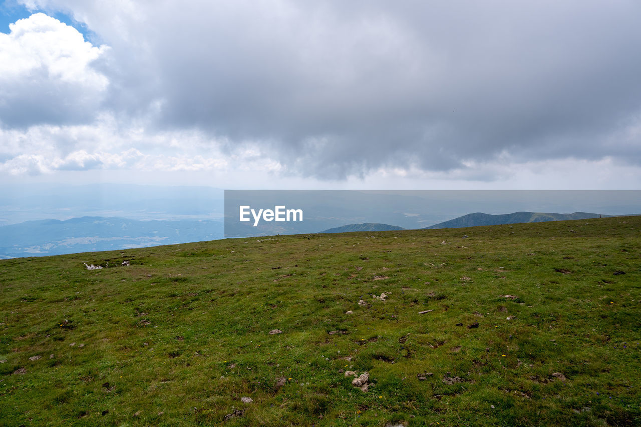 VIEW OF LANDSCAPE AGAINST CLOUDY SKY