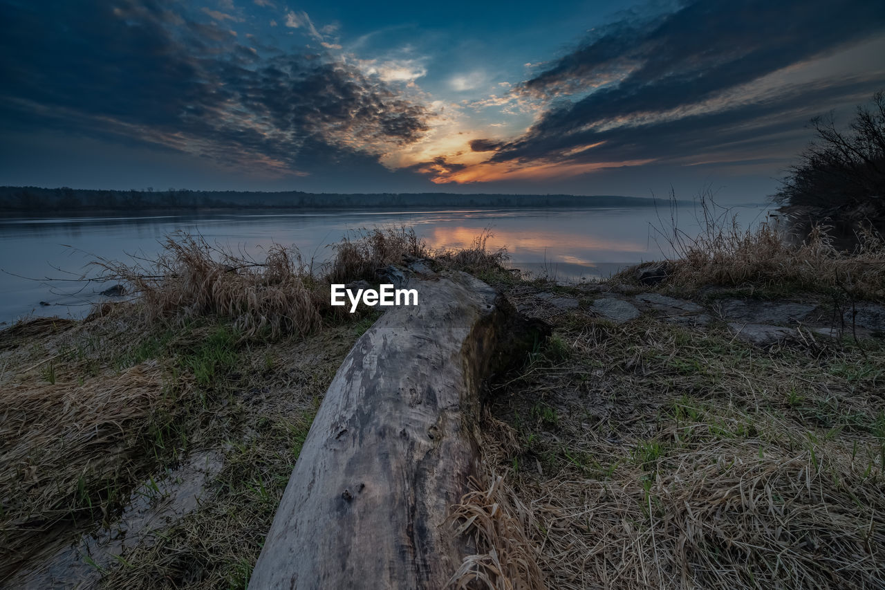 Scenic view of beach against sky during sunset