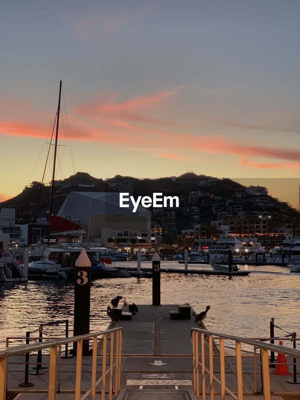 BUILDINGS IN CITY AGAINST SKY DURING SUNSET