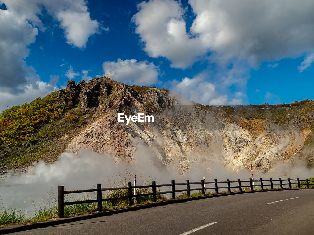 Landscape view of empty road against mountain range