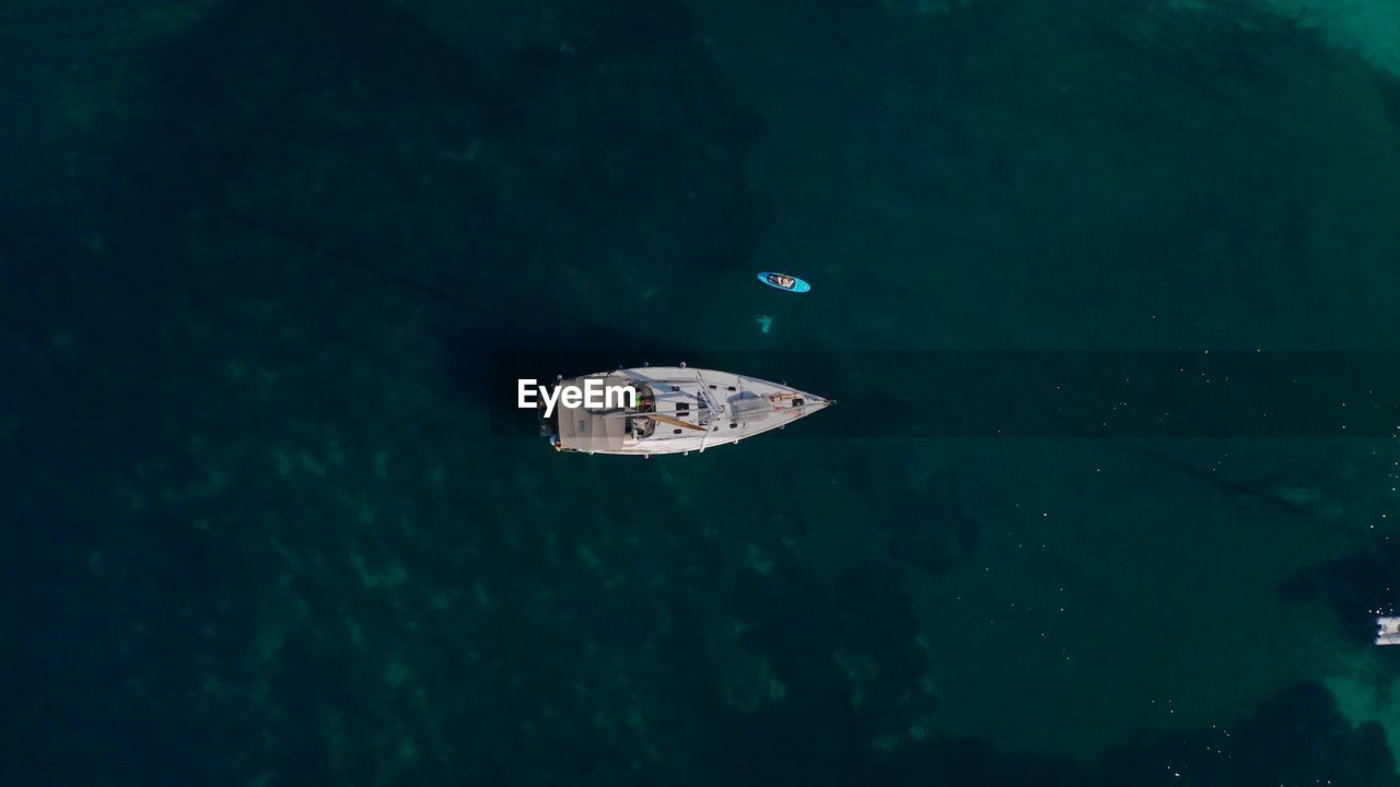 Top view of sail boat in the sea. aerial shot