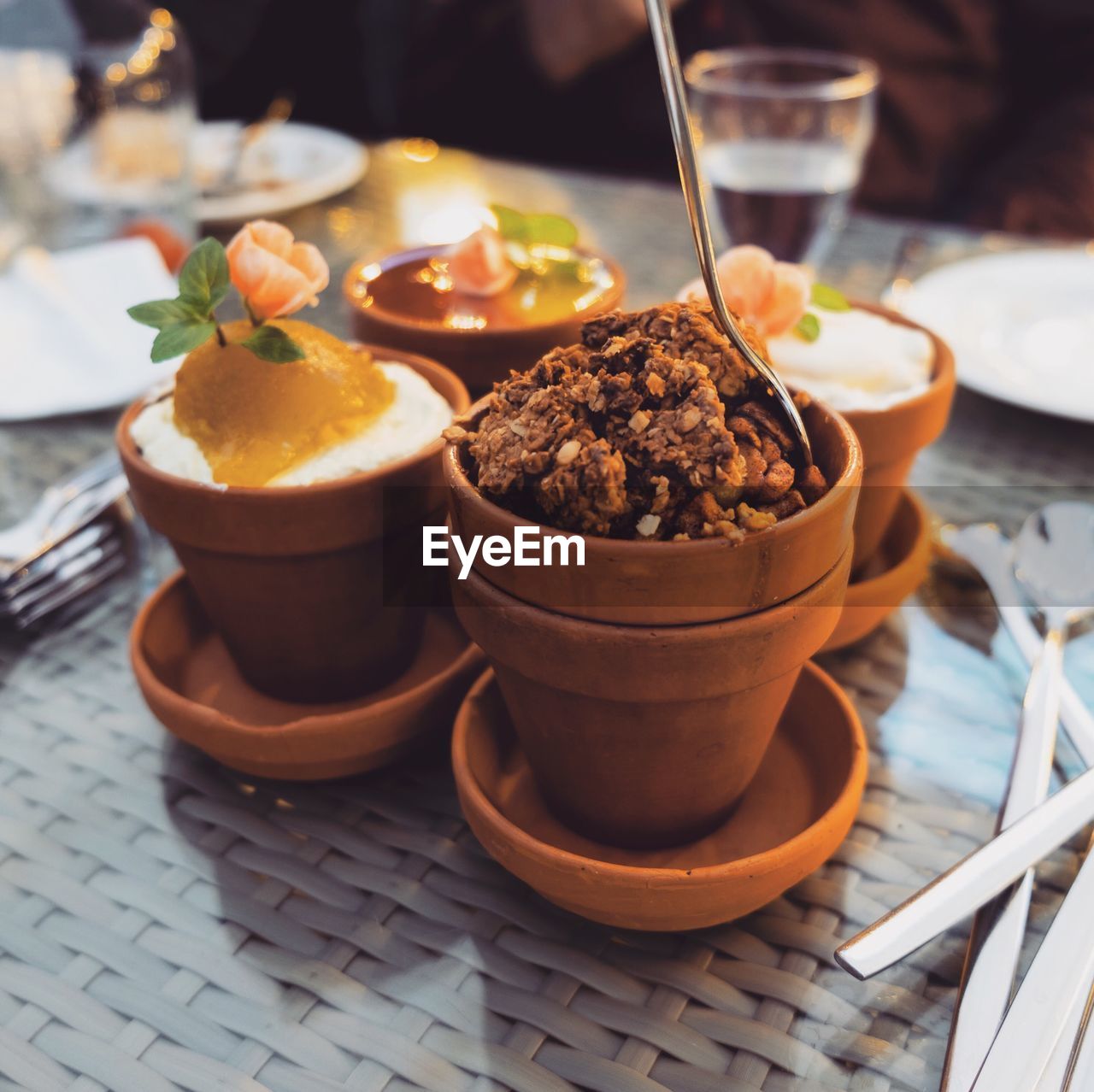 Close-up of dessert in containers on table at restaurant