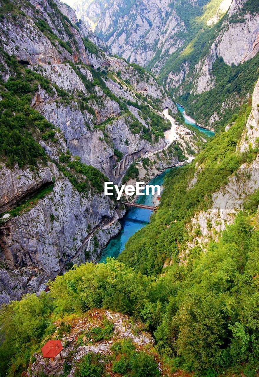 High angle view of river amidst mountains