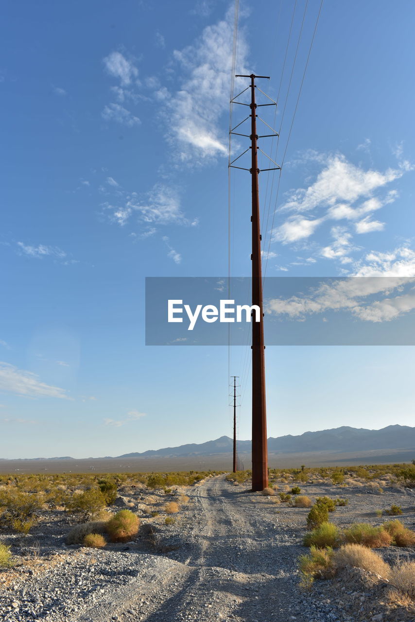 Electrical power poles and power lines along power line road in pahrump, nevada, usa