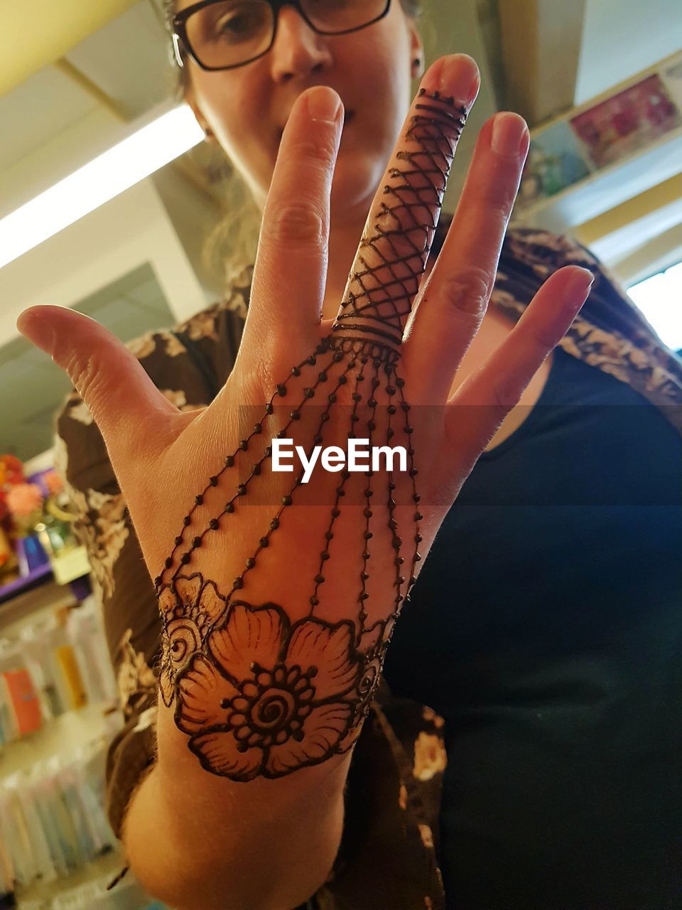 Woman showing henna tattoo