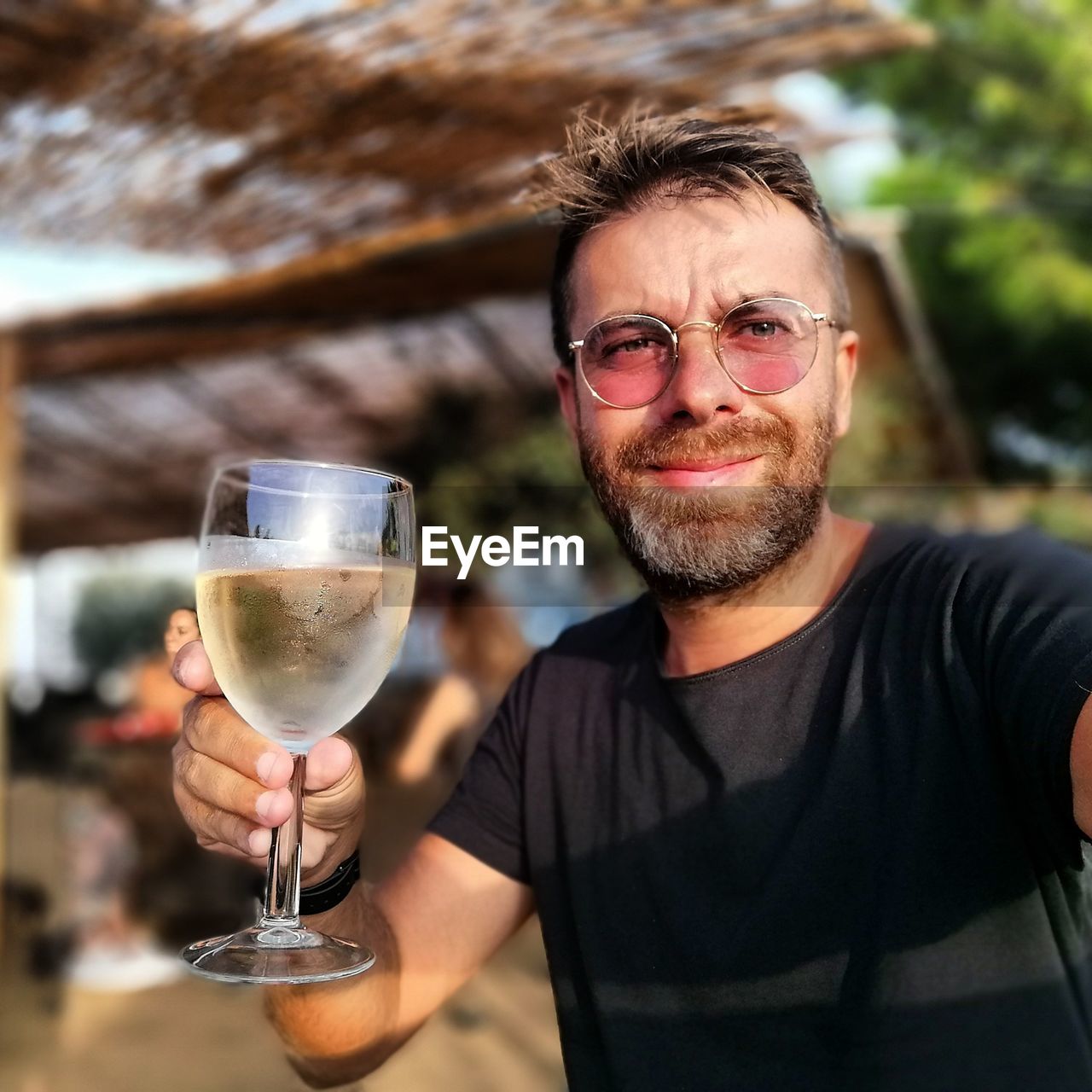 Portrait of smiling man with drink