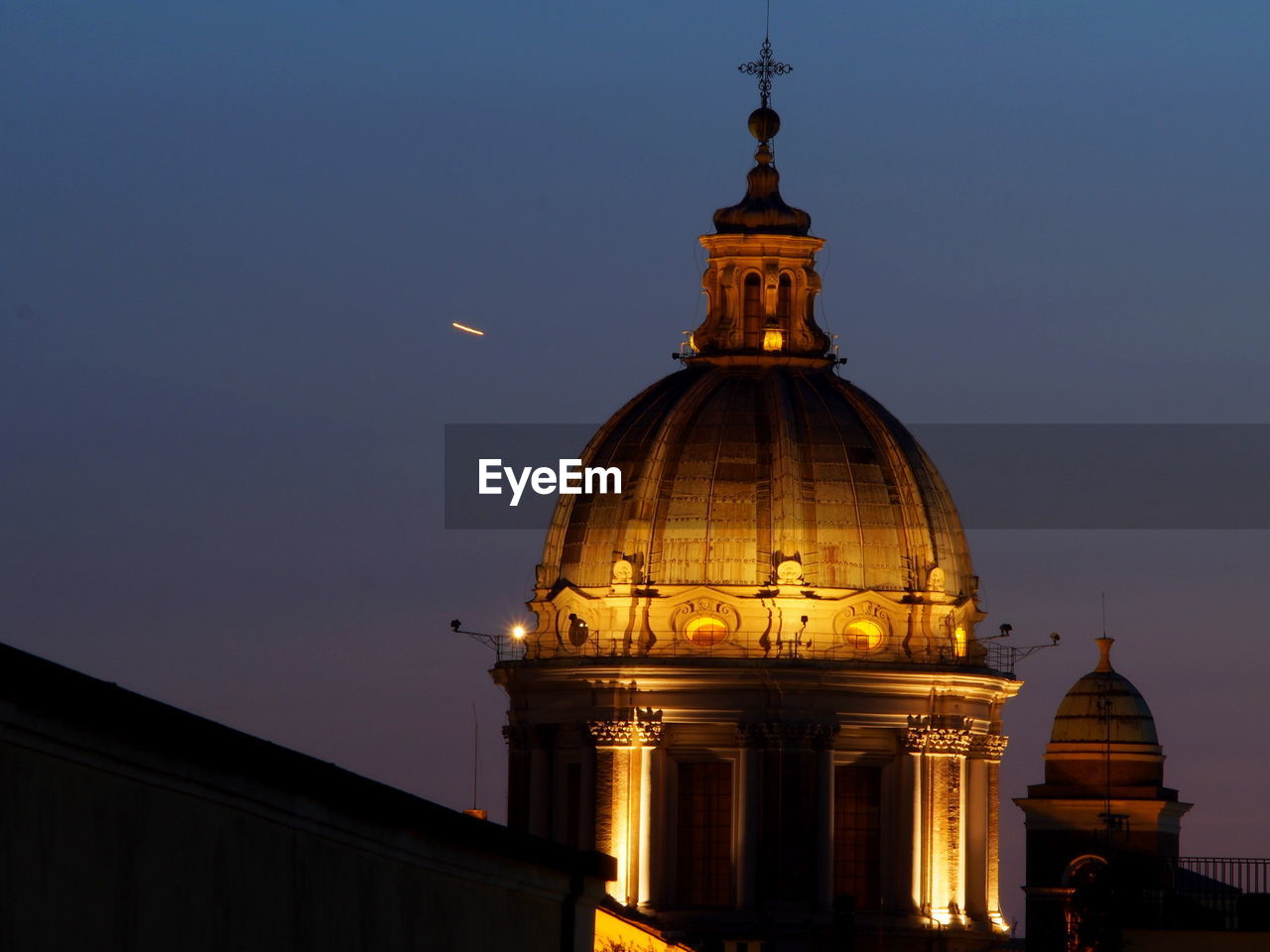 LOW ANGLE VIEW OF ILLUMINATED CATHEDRAL