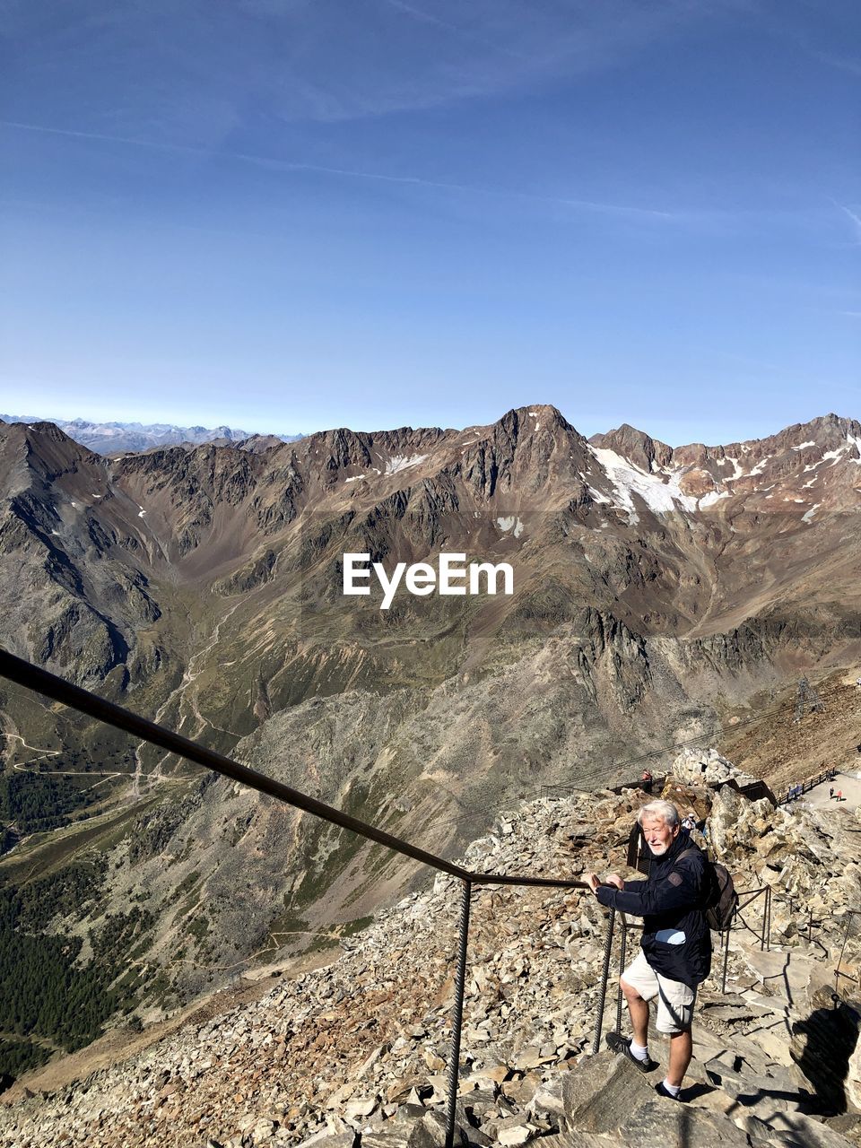 Man on mountain against sky