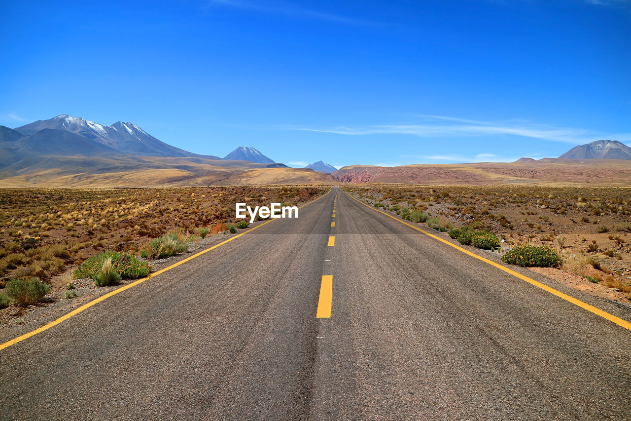 Empty desert road in the los flamencos national reserve, antofagasta region, northern chile