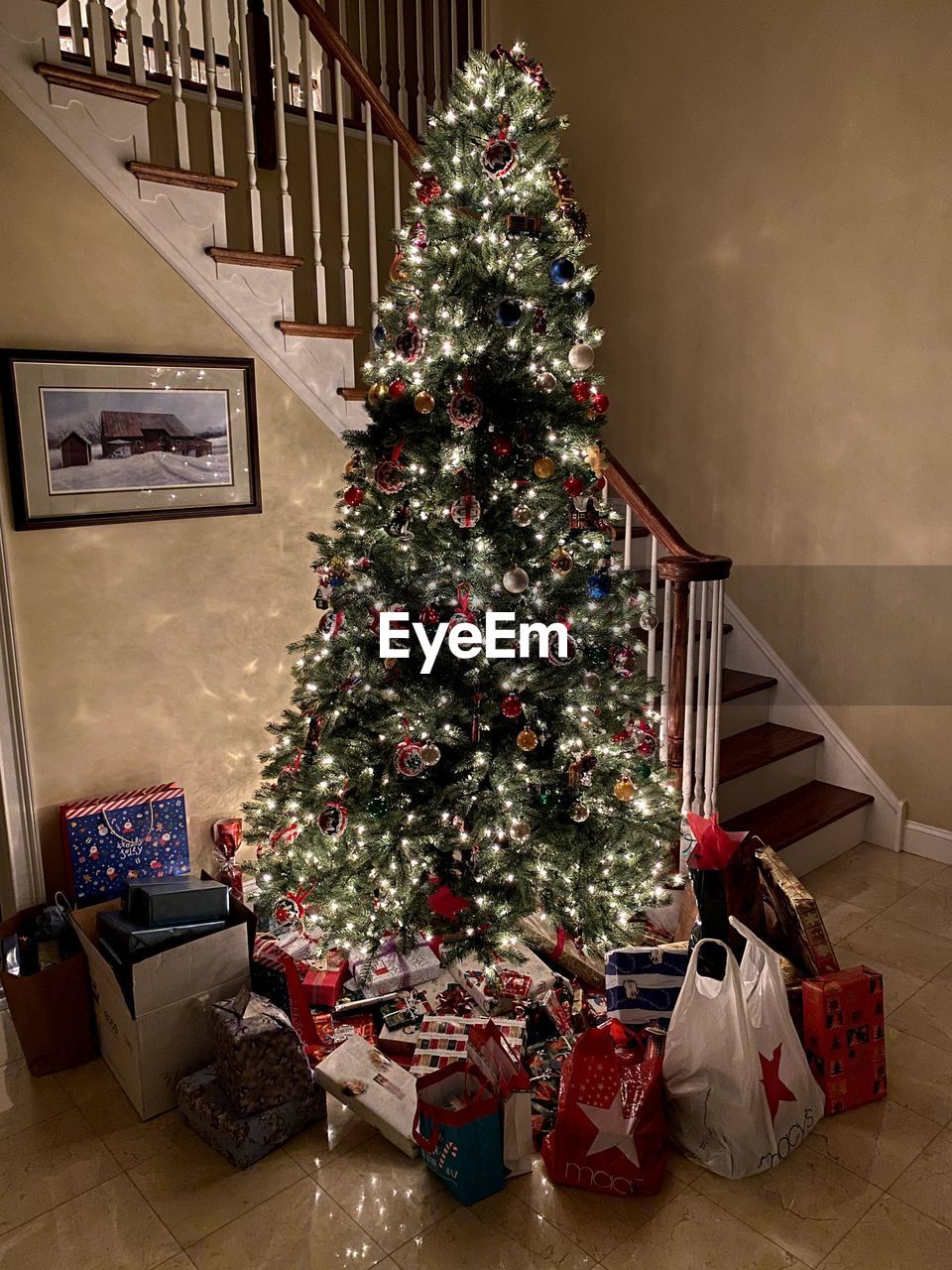 Gifts by christmas tree at home