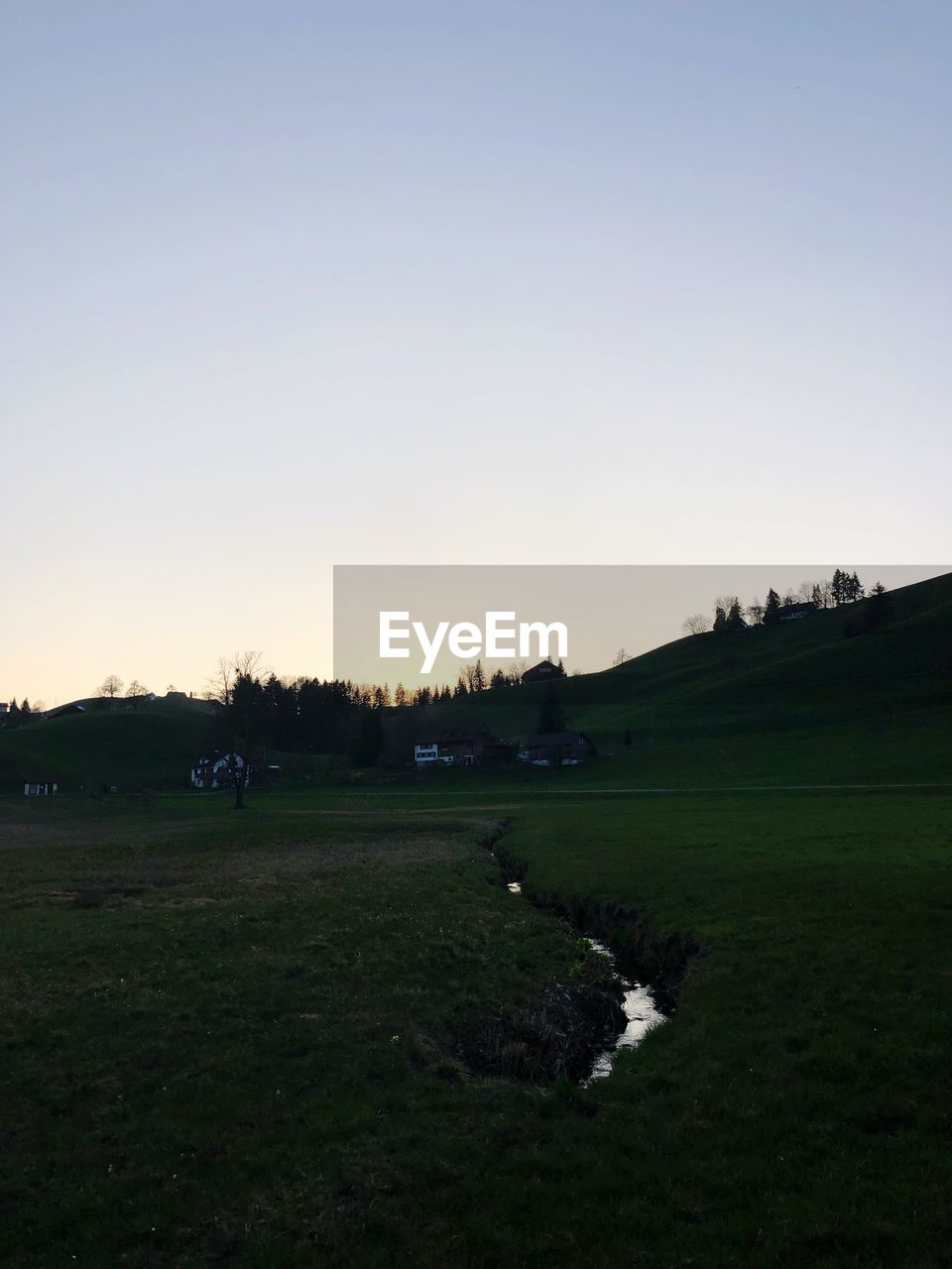 SCENIC VIEW OF LAND AGAINST SKY DURING SUNSET