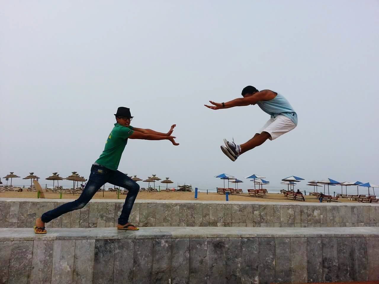 YOUNG WOMAN JUMPING IN MID-AIR