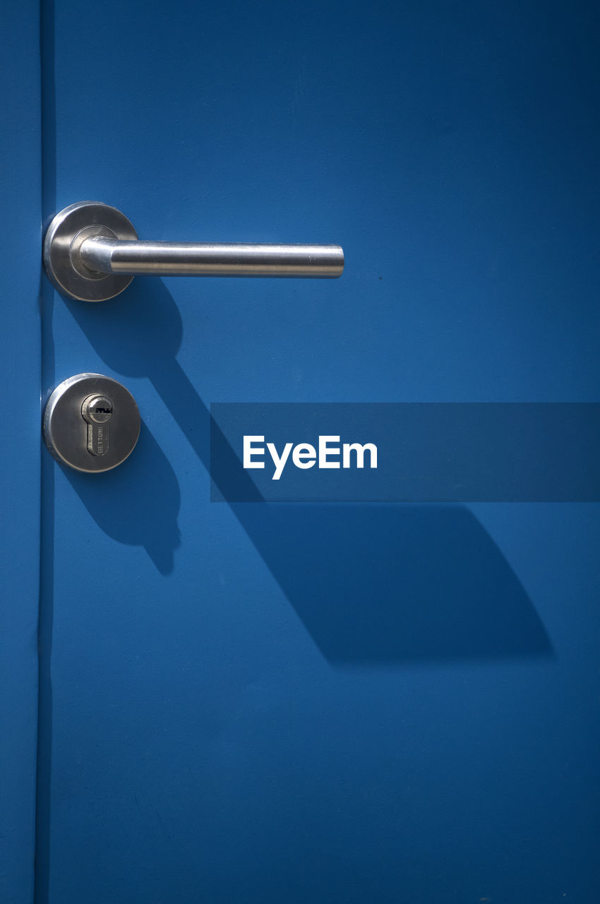blue, door, door handle, entrance, blue background, lighting, no people, metal, colored background, lock, doorknob, security, indoors