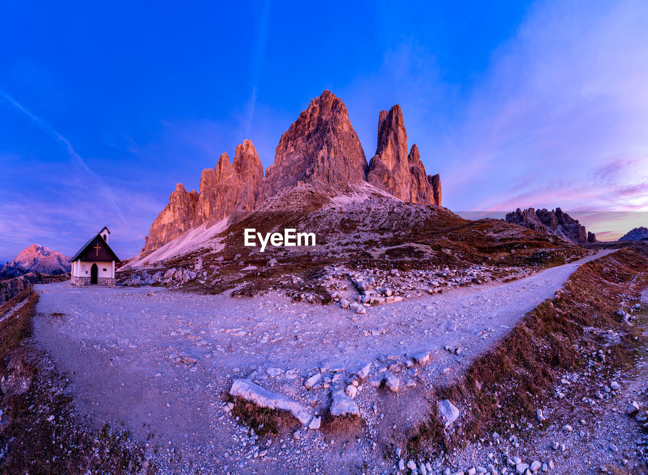 Scenic view of rocky mountain against sky during winter