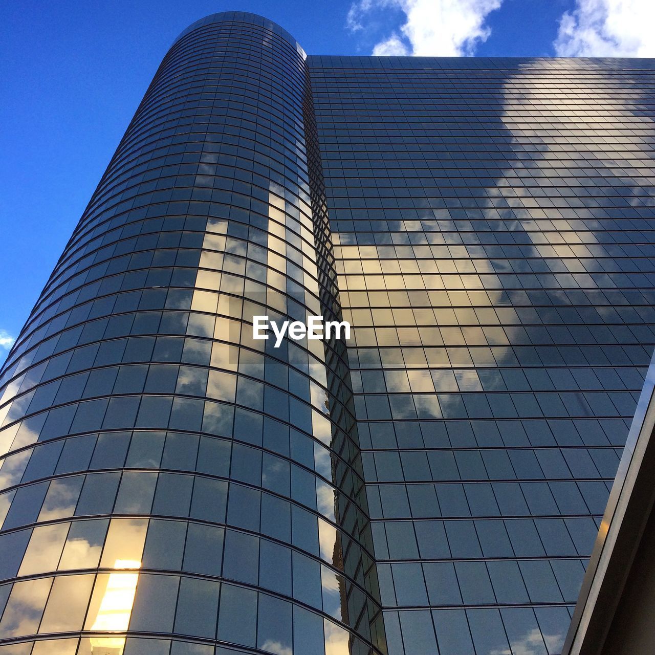 Low angle view of modern office building against sky