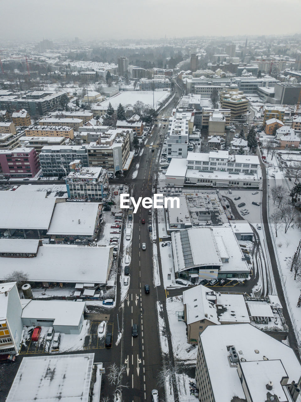 High angle view of buildings in city during winter