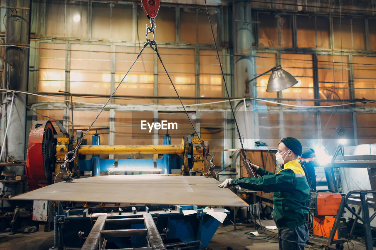 rear view of man working on table