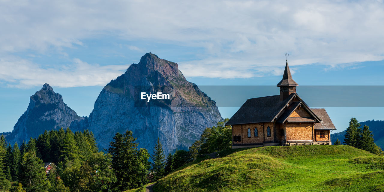 View of an old wooden church in the swiss mountains on lake lucerne.
