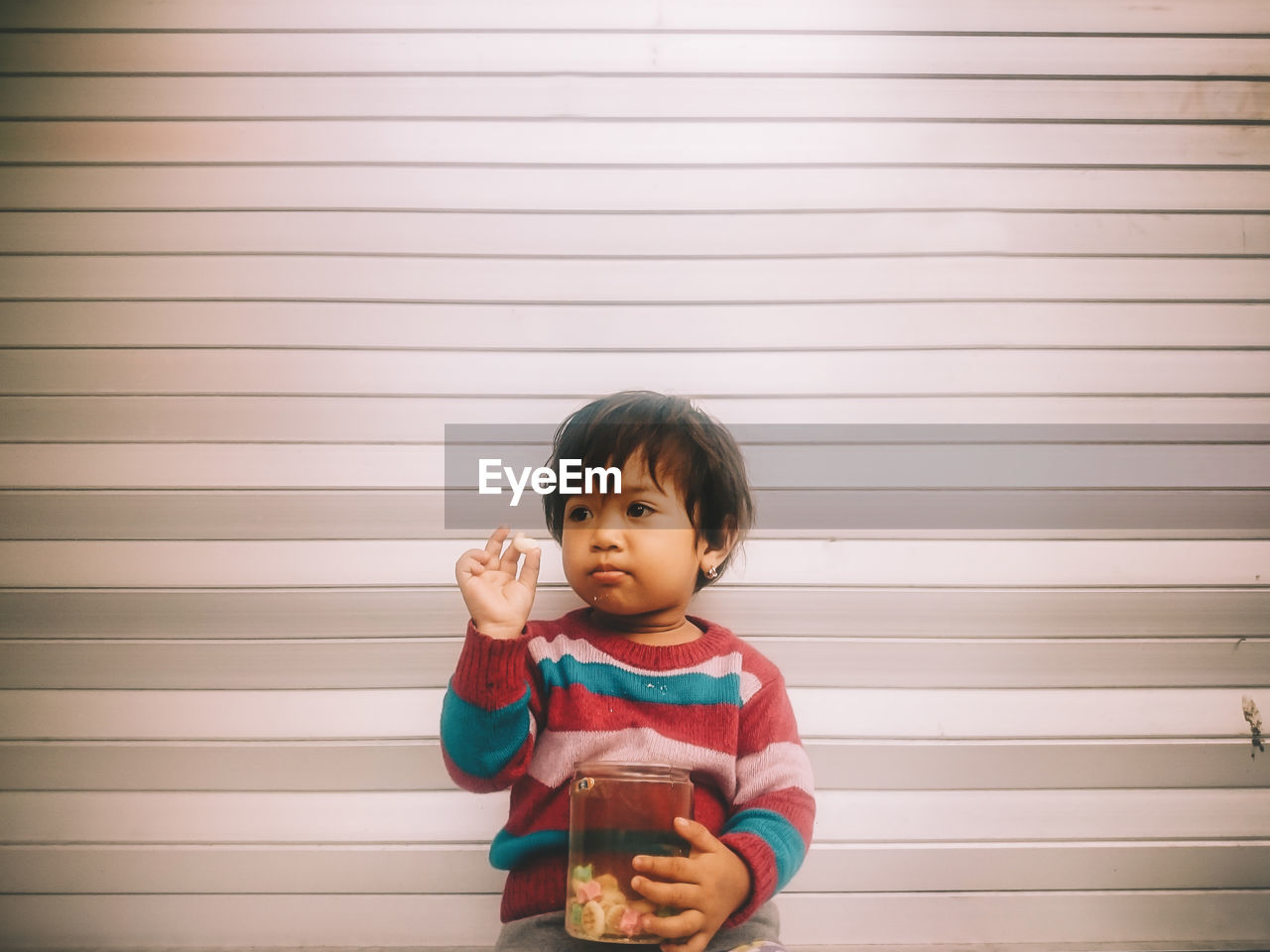 Portrait of cute child with candy